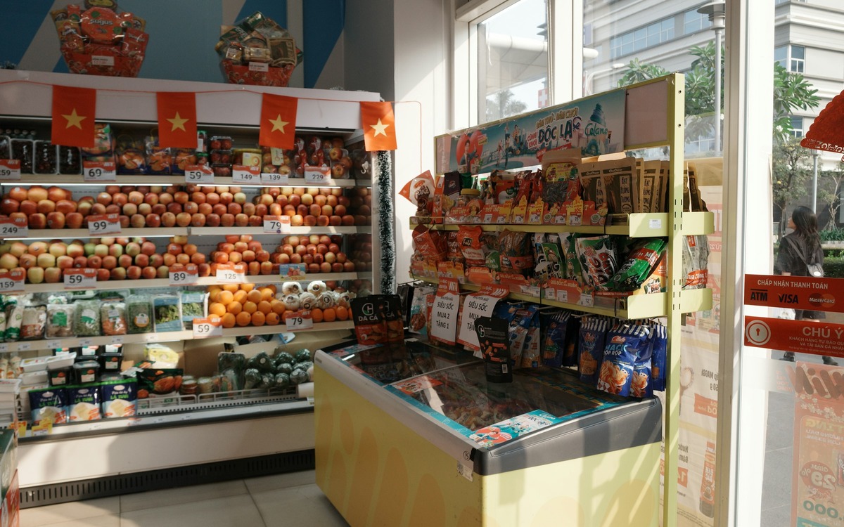 A grocery store aisle with fresh produce and packaged foods