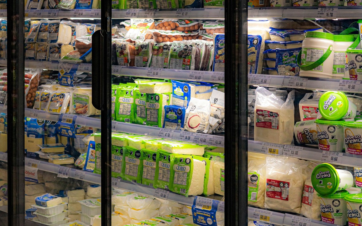 Milk and dairy products stored in a refrigerated grocery case
