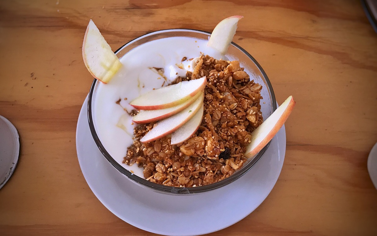 Yogurt bowl with fruit and granola as an example of adding toppings at home