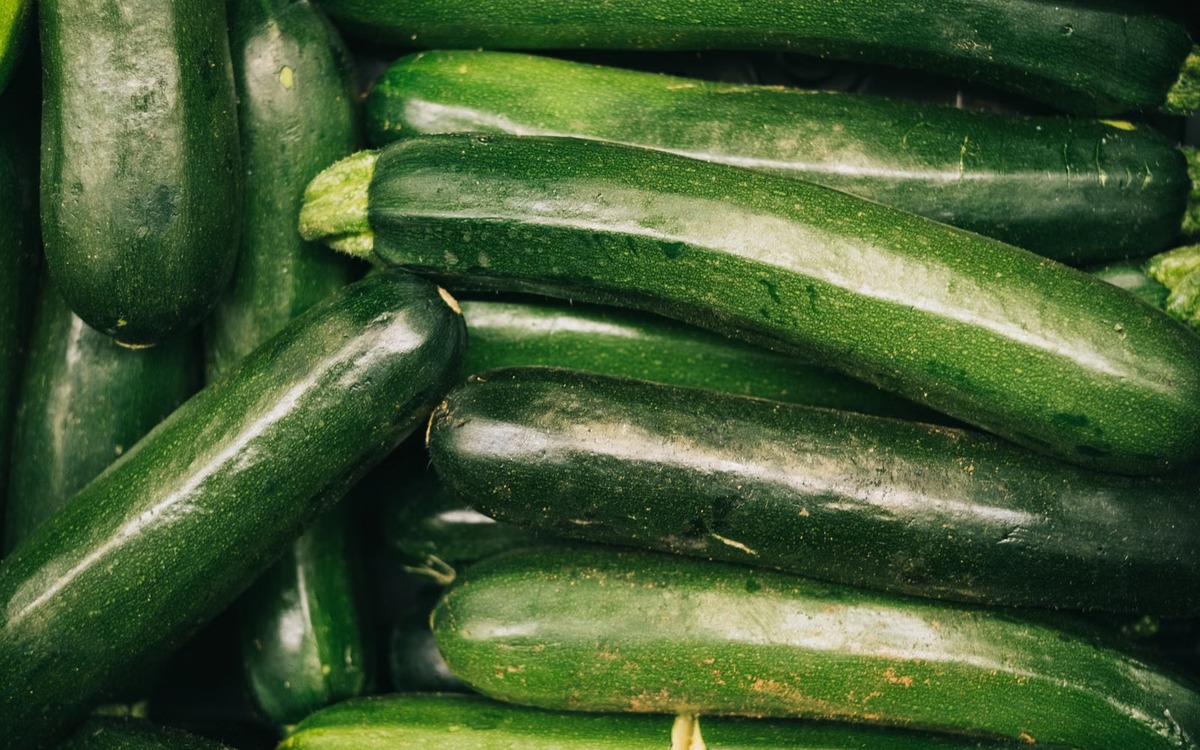 Fresh zucchini stored in a refrigerator crisper drawer